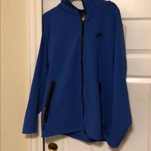 Blue Nike tech fleece hoodie.